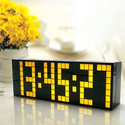 Fuchsia Molly Home LED Digital Clock displaying time in a modern living room setting, perfect for home and garden decor.