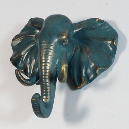 Decorative resin elephant head hook by Fuchsia Molly, perfect for home and garden wall decor and functional hanging storage.