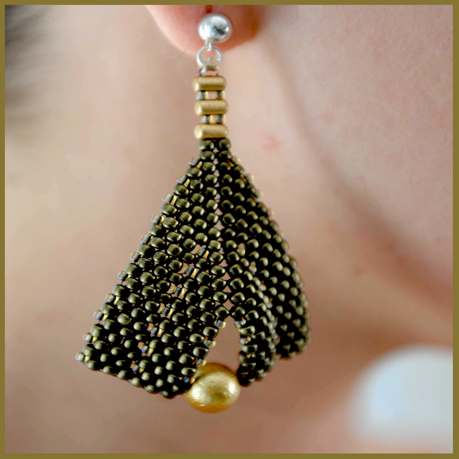Gold metallic suede and pearl earrings by Maroon Smudge featuring elegant gold accents and a sophisticated design.