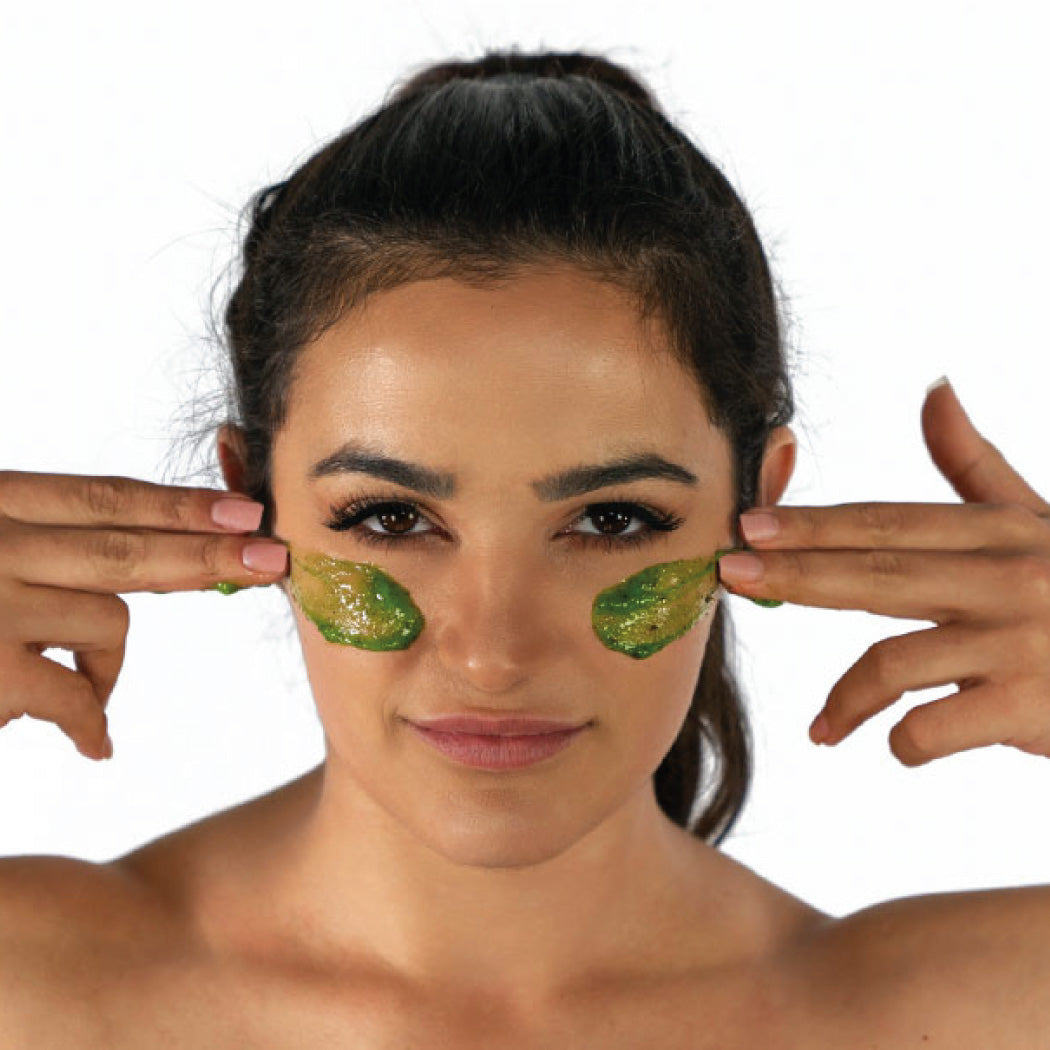 Cyan Ares Detoxifying Exfoliating Mask applied on clean skin, showcasing its smooth, clay-like texture for skincare and pore cleansing.