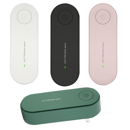 Teal Simba plug-in air purifier mini eliminator and freshener for home, showing compact device with vents and control buttons.