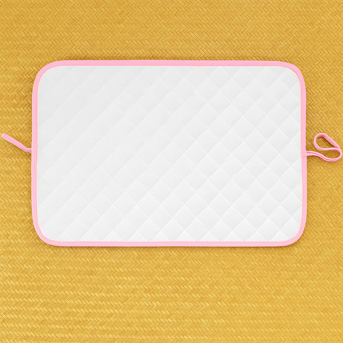 Pink Nomadic changing mat for kids and babies by Chocolate Briseis, featuring soft, portable surface for easy diaper changes.