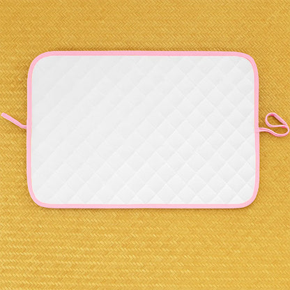 Pink Nomadic changing mat for kids and babies by Chocolate Briseis, featuring soft, portable surface for easy diaper changes.