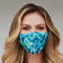 Cyan Poppy tropical banana leaves face mask for women with vibrant leafy pattern and comfortable fabric design.