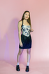 Black silk Stevie short skirt by Amber Lemon, featuring a sleek, fitted design with a smooth hem and stylish silhouette.