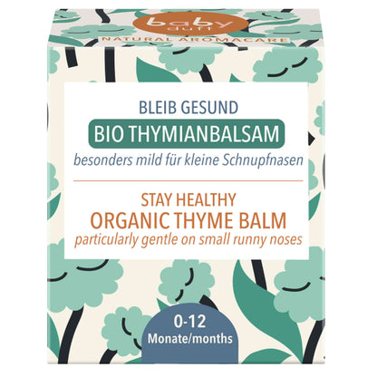 Gray Hercules BABYDUFT Stay Healthy Thyme Balm for babies 0-12 months, Swiss-made, in a small jar with natural thyme ingredients.