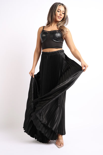 Black satin maxi skirt with elastic high waist, A-line silhouette, and pleated design by Puce Juniper.