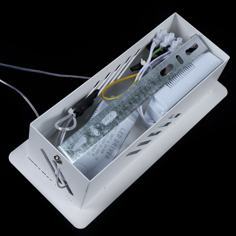 Contemporary acrylic LED swirl-shaped light fixture by Yellow Pandora, modern lighting with sleek, artistic design.