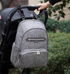 Maroon Chronos foldable diaper backpack with multiple compartments and adjustable straps, designed for parenthood and travel.