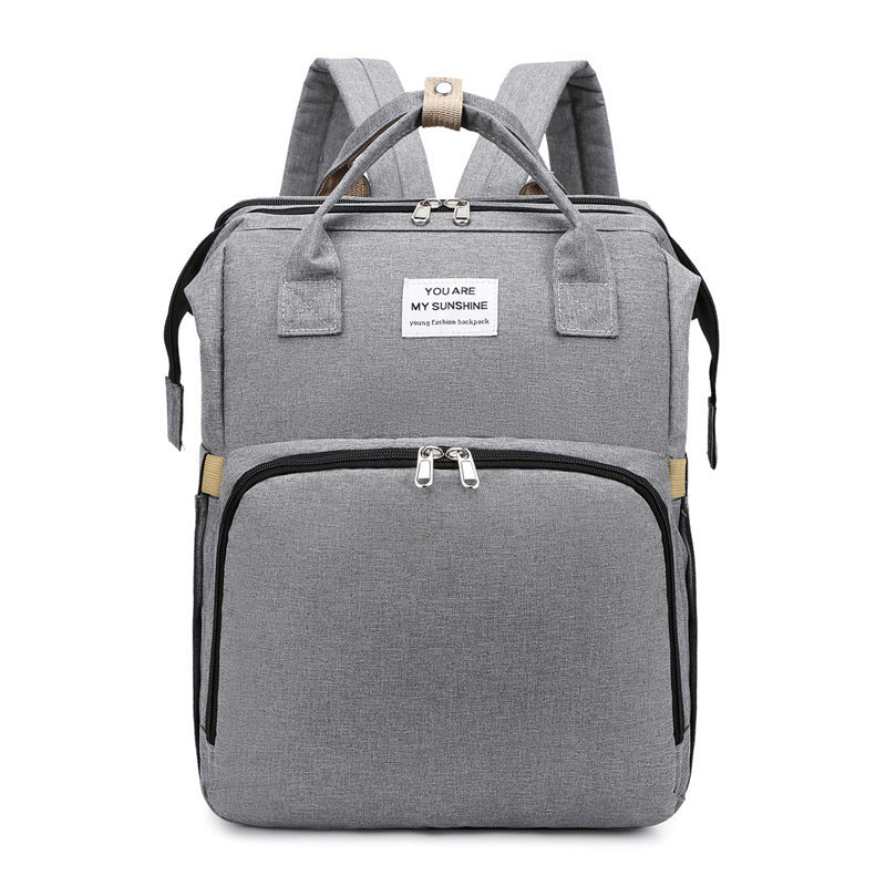 Carmine Juneberry ALLFASHION™ FoldAway BabyNest Backpack with adjustable straps and compact foldable design for parents on the go