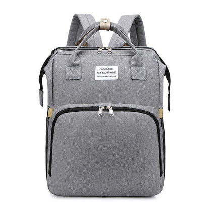 Carmine Juneberry ALLFASHION™ FoldAway BabyNest Backpack with adjustable straps and compact foldable design for parents on the go