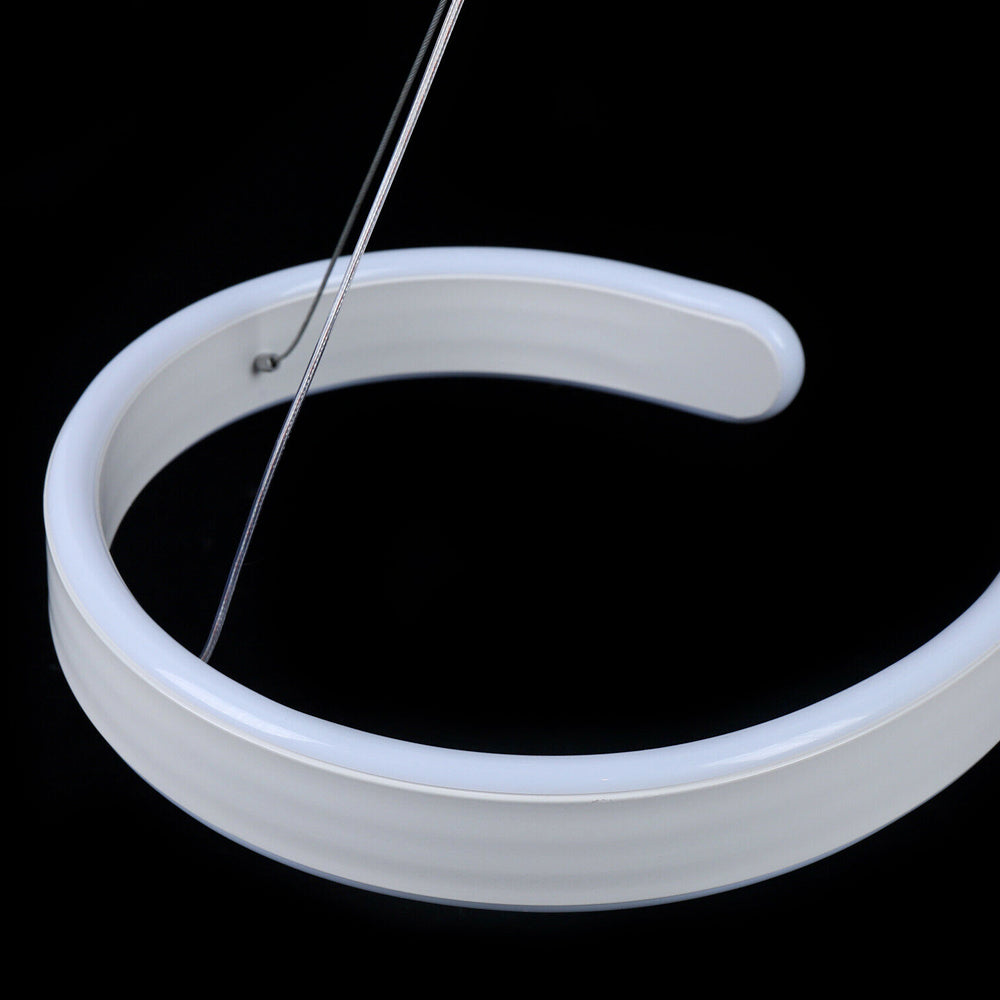 Contemporary acrylic LED swirl-shaped light fixture by Yellow Pandora, modern lighting fixture with sleek, artistic design.