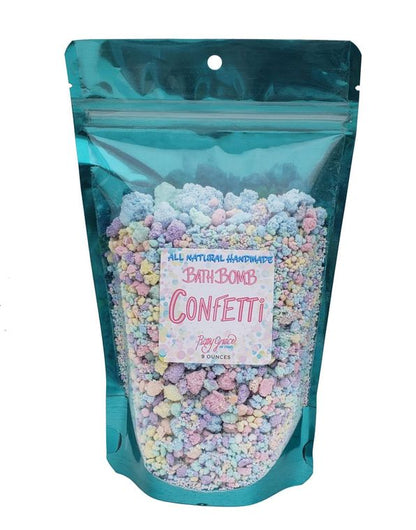 Colorful Orchid Missy bath bomb confetti with vibrant, mixed bath and beauty product pieces in a relaxing bath setting.