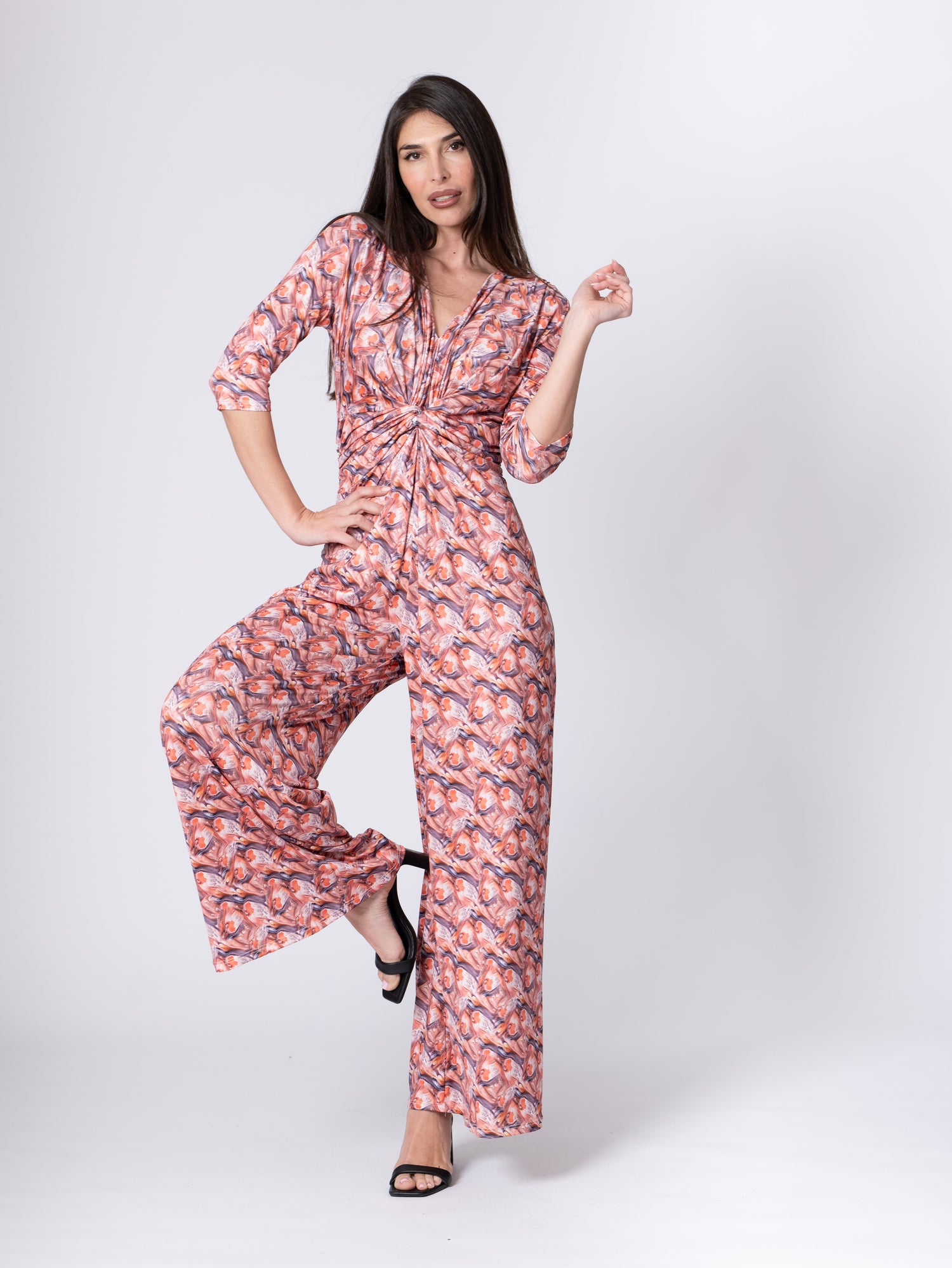 Fuchsia Amymone printed jumpsuit with V-neck, front knot detail, and elastic waist, perfect for casual and stylish looks.