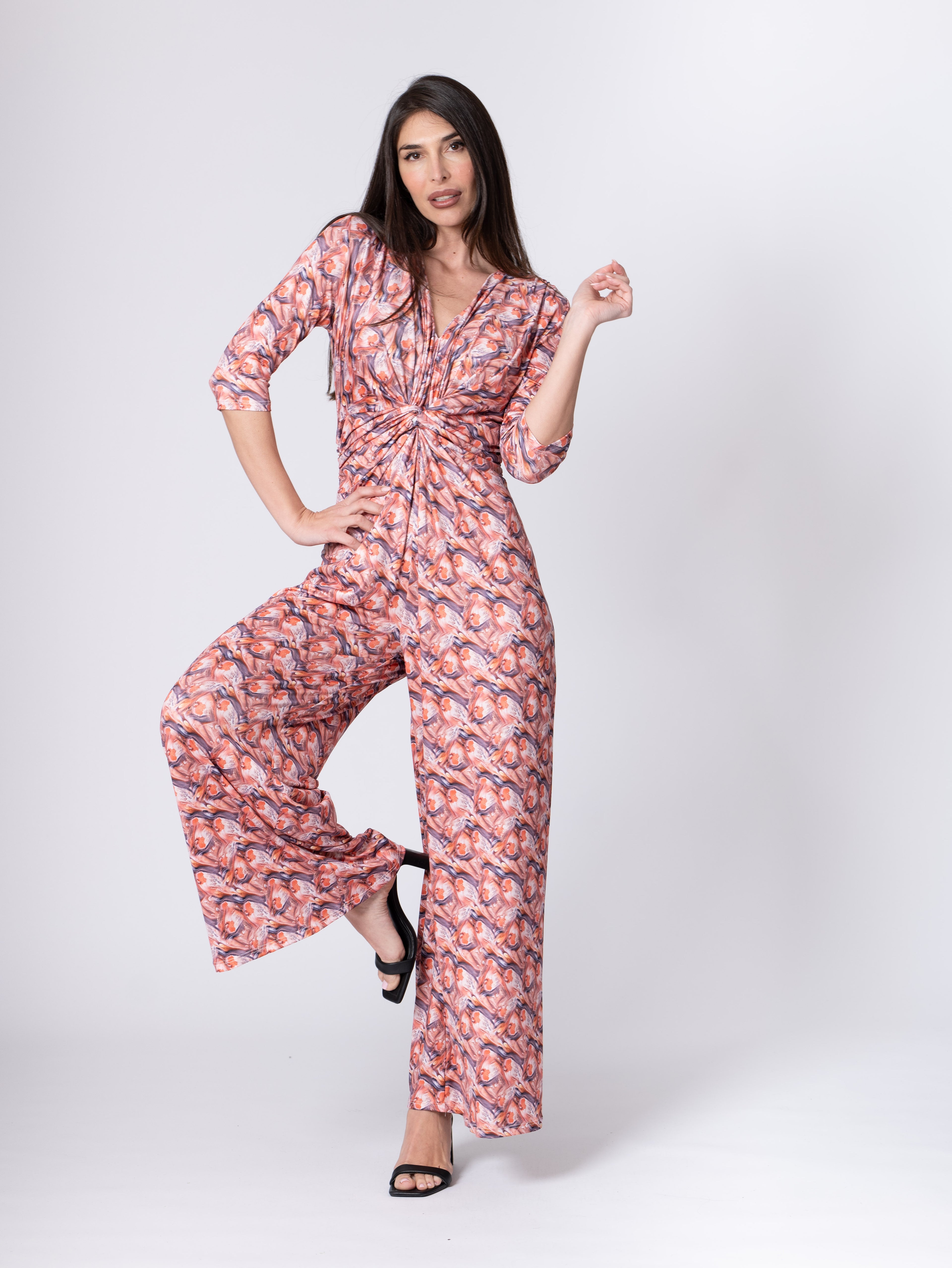 Fuchsia Amymone printed jumpsuit with V-neck, front knot detail, and elastic waist, perfect for casual and stylish looks.