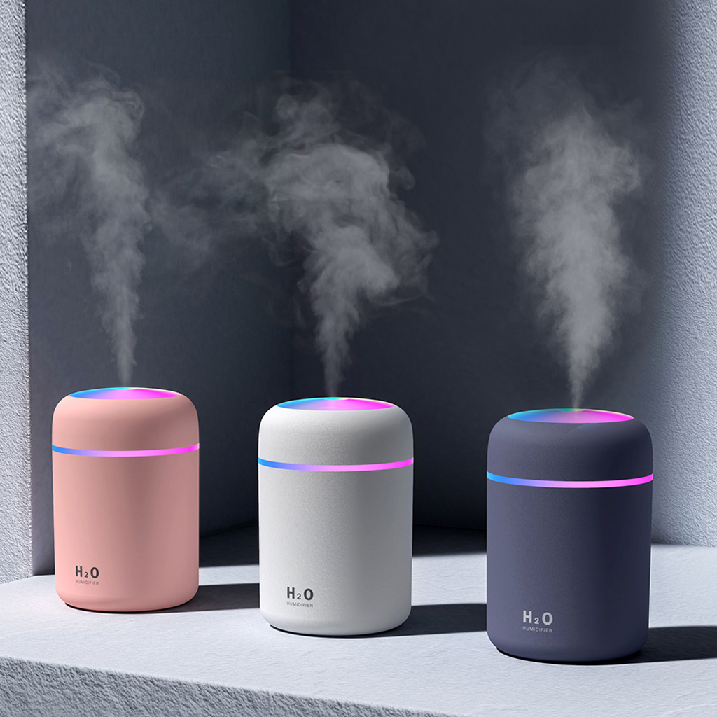 Teal Simba portable air humidifier and essential oil diffuser for car and home use, with a sleek white design and adjustable settings.