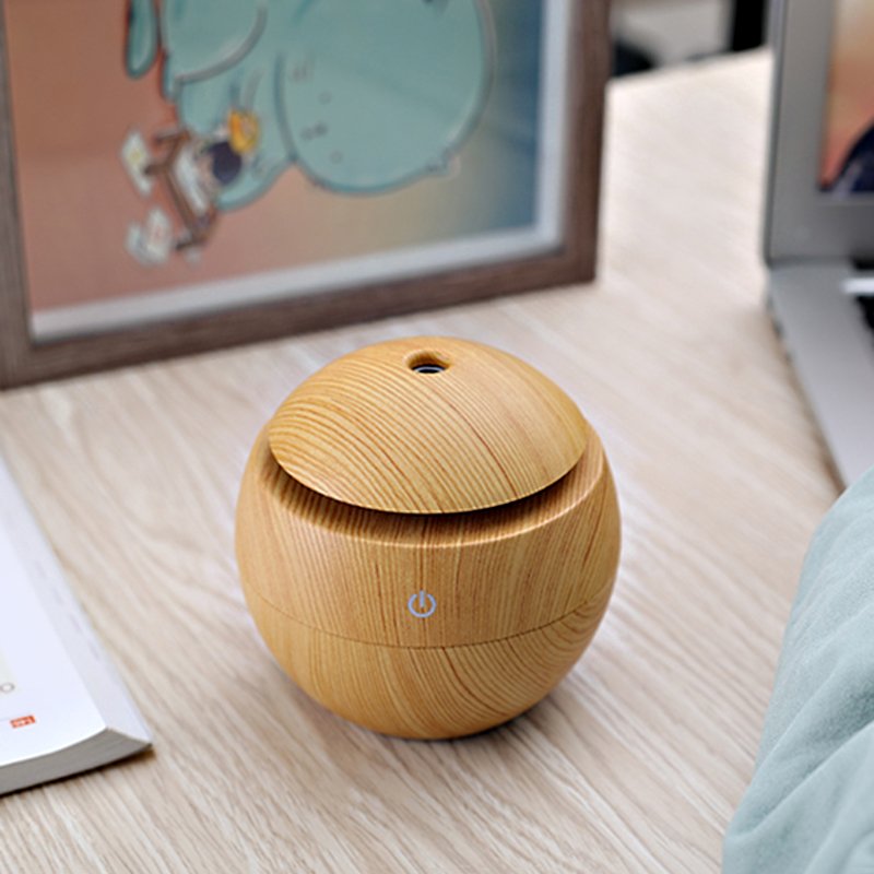 Fuchsia Molly wood grain desktop humidifier with sleek design for home and garden use, displaying the humidifier on a wooden surface.