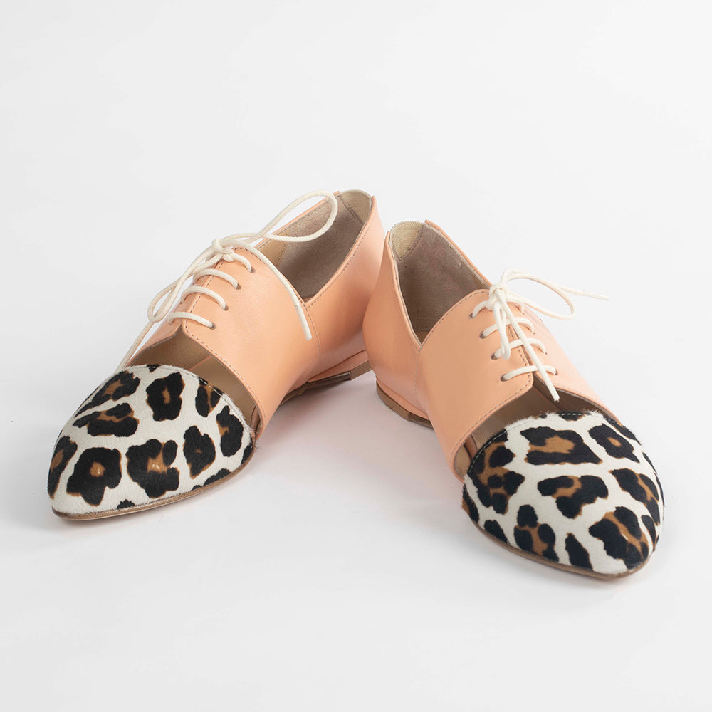 Pink Tulip Sapien calf hair leather flats, stylish slip-on shoes with a sleek design and textured animal print.