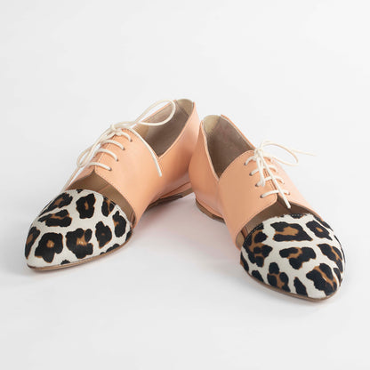 Pink Tulip Sapien calf hair leather flats, stylish slip-on shoes with a sleek design and textured animal print.