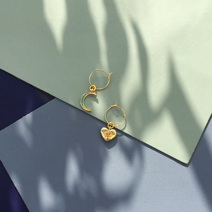 Yellow Athena crystal moon earrings featuring sparkling moon-shaped charms with delicate hooks for pierced ears.