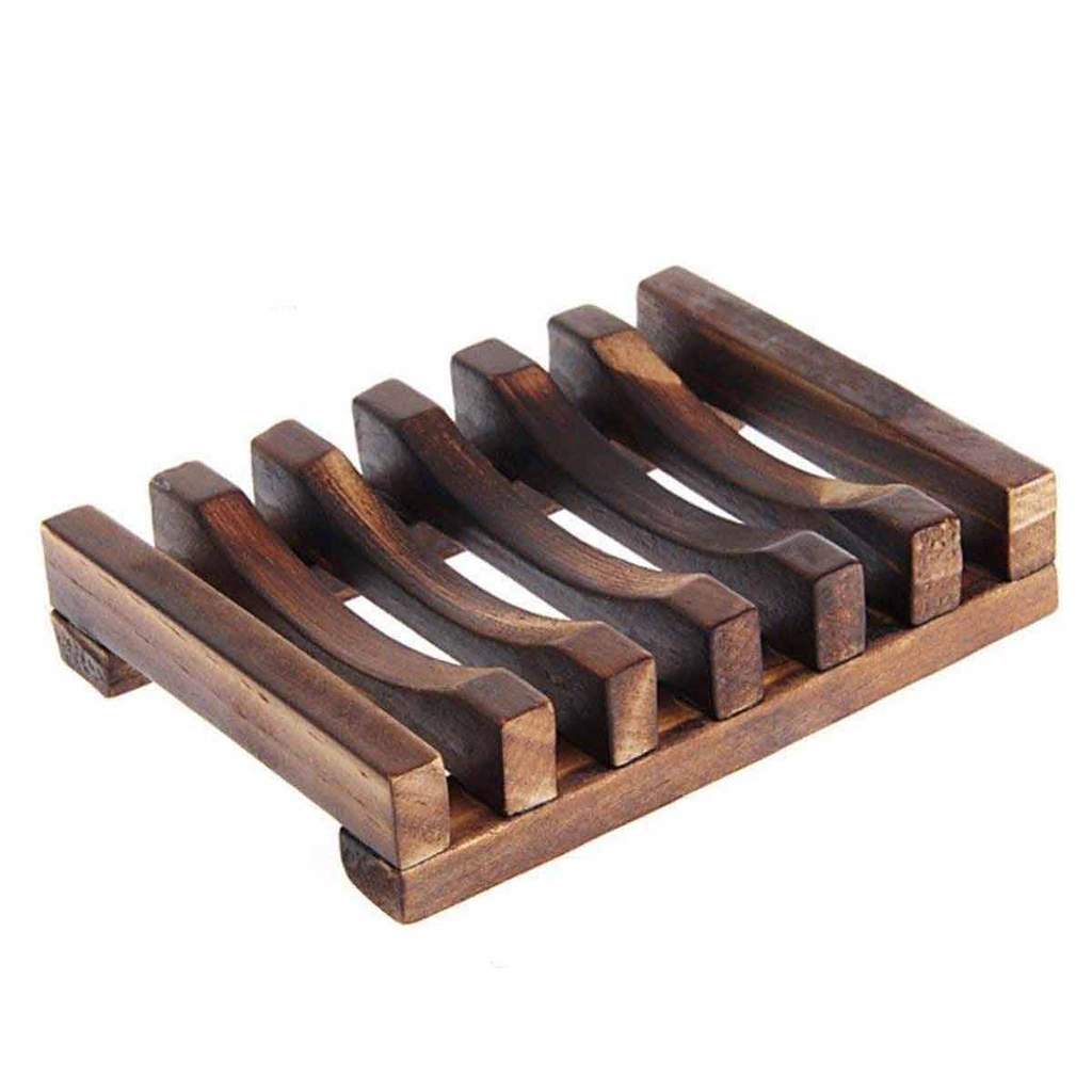 Wooden soap dish from Black Oliver for bodycare, featuring a smooth, natural wood finish with drainage slots.