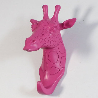 Fuchsia Molly resin giraffe head hook for home and garden decor, featuring detailed giraffe design and functional wall hook.