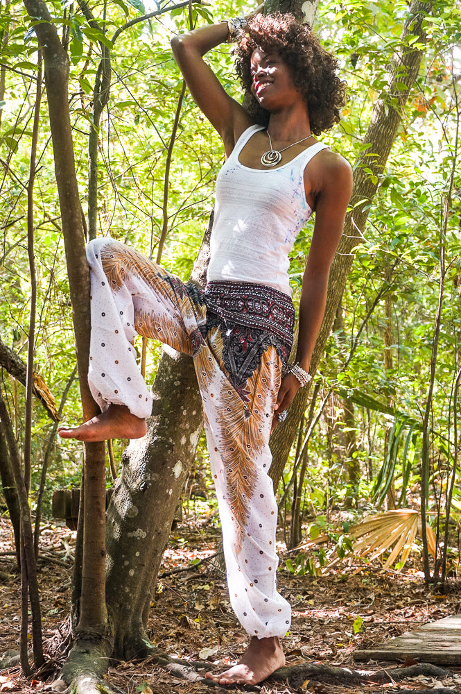 White Peacocks women’s boho yoga pants by Tan Smokey featuring loose, flowy fabric and bohemian style for comfortable wear