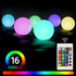RGB color-changing LED ball lights from Lilac Milo floating pool lighting, glowing with vibrant, changing colors in the water.