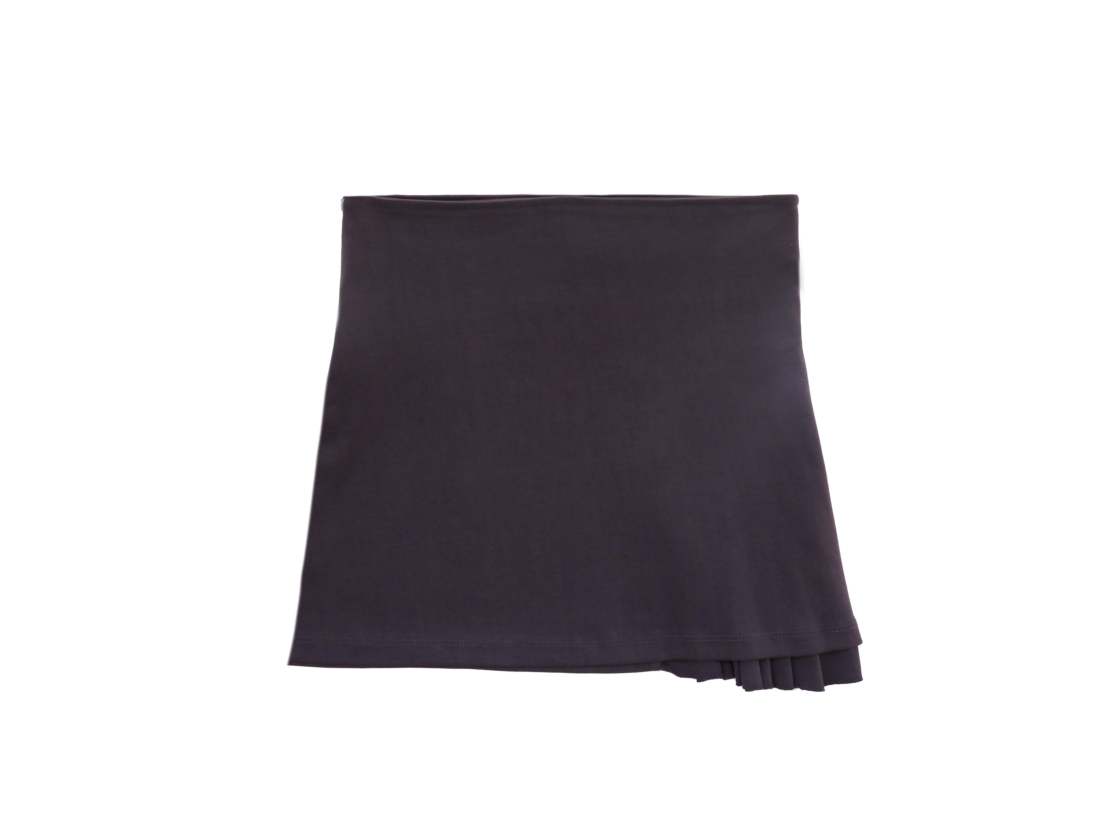 Emerald Hephaestus half-pleated mini skirt shown on a model, featuring a stylish, short skirt with pleats for a trendy look.