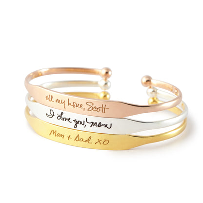 Handwritten cuff bracelet by Green Millie featuring a sleek cufflink design with elegant handwritten details.