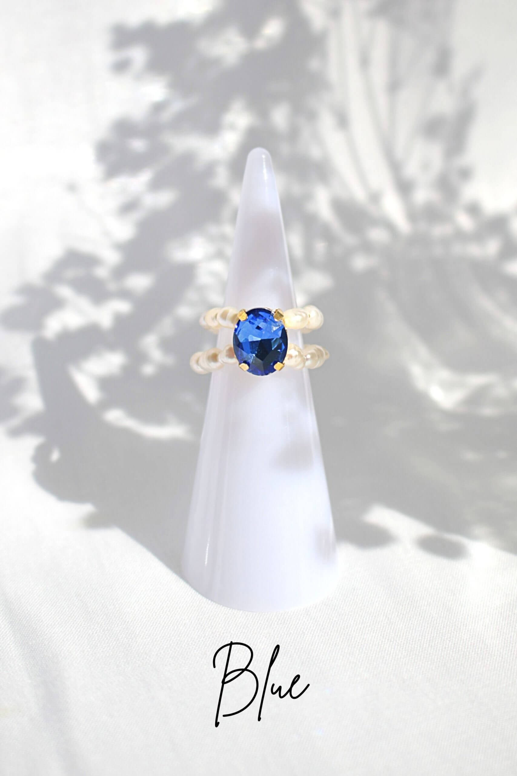 Ultramarine Birch 3 shades blue CZ and freshwater pearl rings with silver bands, showcasing elegant jewelry design.