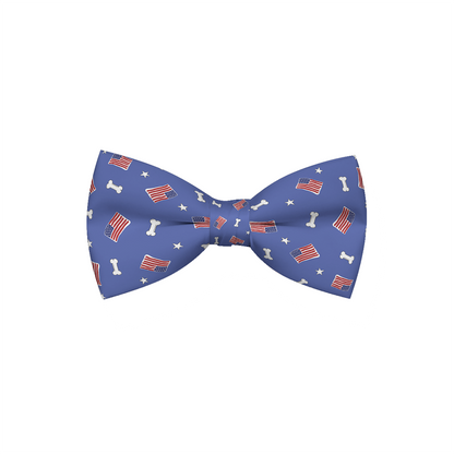 Red, white, and bones American flag dog bow tie by Plum Semele, featuring patriotic design on petwear accessory.