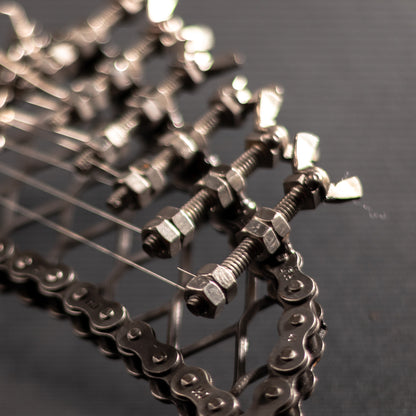 Metal electric guitar sculpture by Turquoise Poppy, heavy metal wall art decor, showcasing a detailed, artistic guitar design for home decoration.