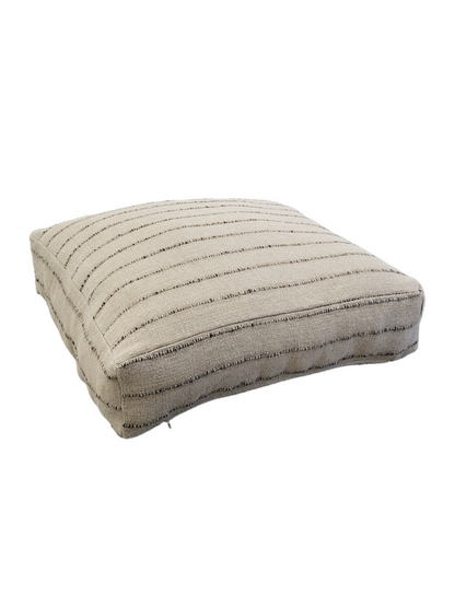 Purple Cassiopeia Nomad floor cushion and pouf made of soft fabric, perfect for seating and decor in living spaces.