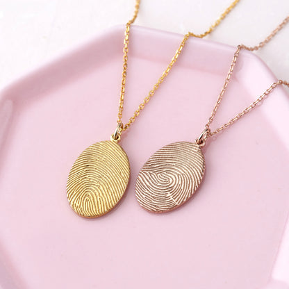 Green Millie fingerprint necklace featuring a memorial thumbprint pendant on a delicate chain.