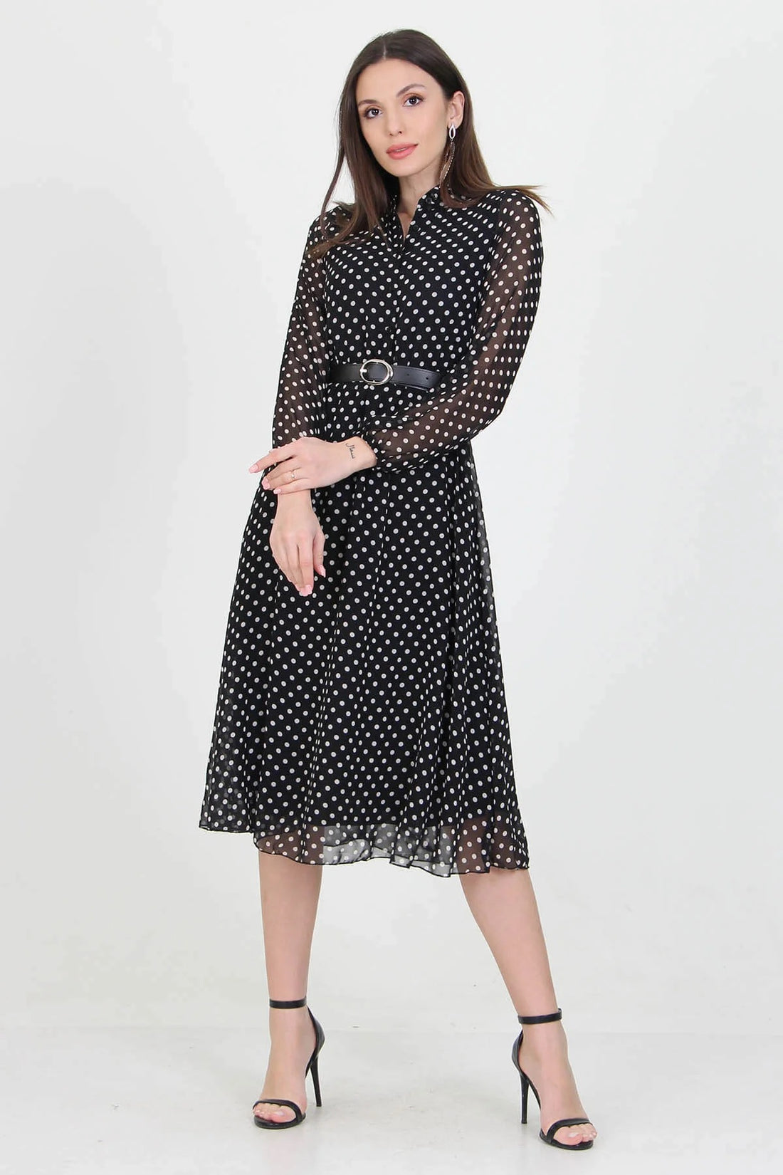 Black polka dot dress by Aquamarine Felix featuring a fitted bodice and flowing skirt, perfect for casual or semi-formal occasions.