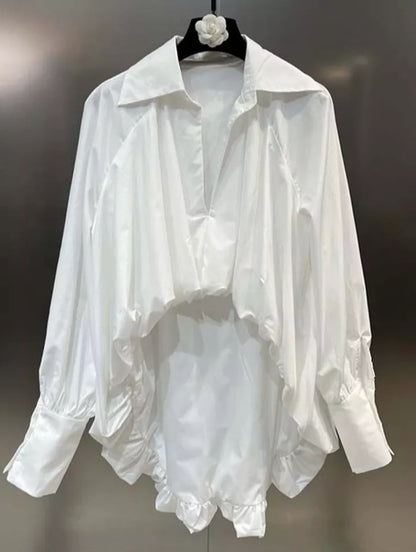 Elegant Mauve Ananke asymmetric women’s blouse with minimalist design, irregular hem, and stylish fit, perfect for modern fashion.