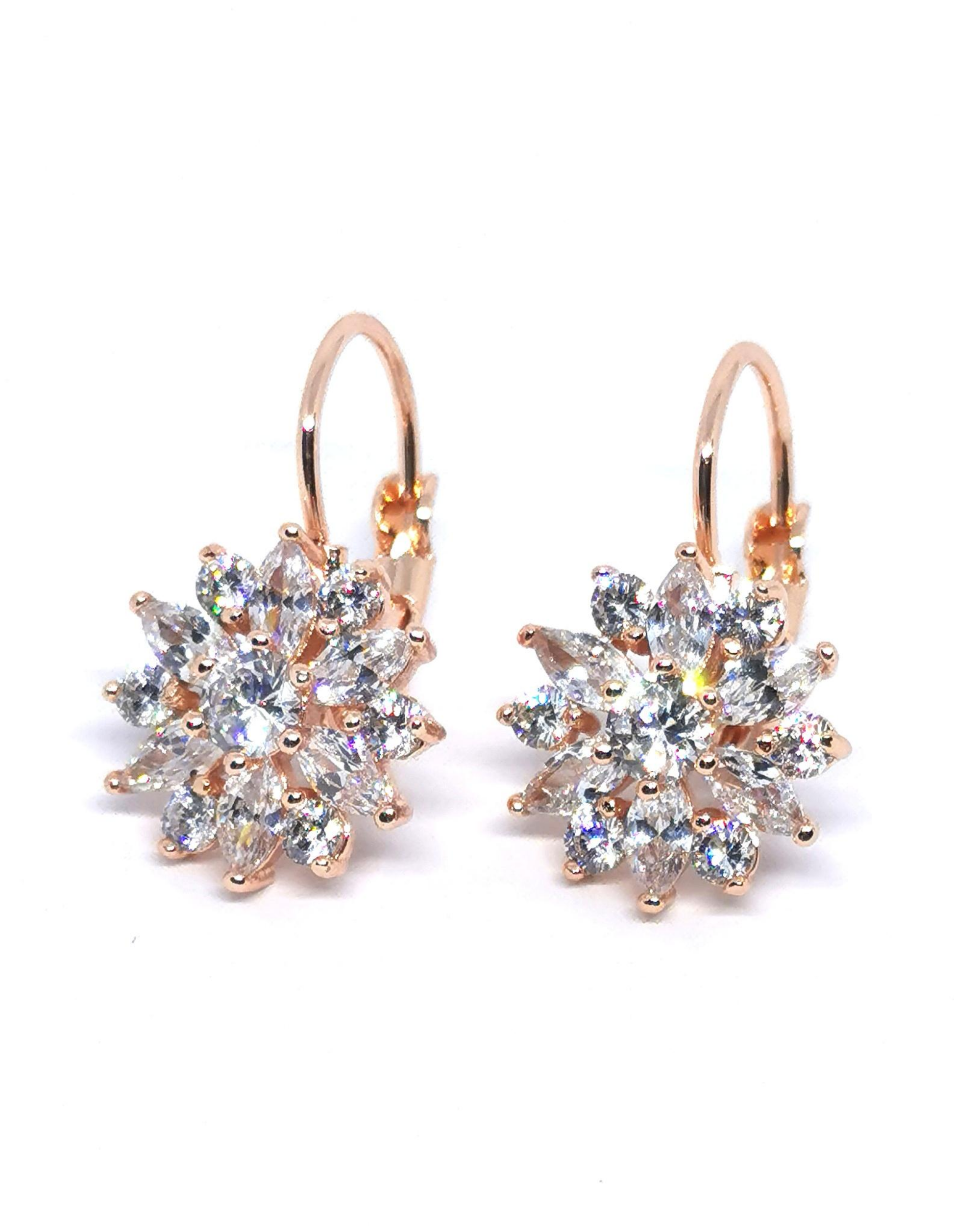 Diamond sunflower huggies earrings with 18K gold plating from Ultramarine Birch, featuring detailed sunflower design.