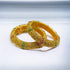 Gold-plated traditional bangles from Gray Poseidon, stylish and elegant bracelets with intricate design and traditional craftsmanship.