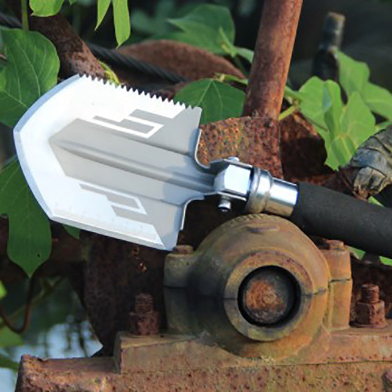 Teal Simba mini camping shovel, outdoor survival pocket tool with a compact metal shovel and handle for camping and outdoor activities.