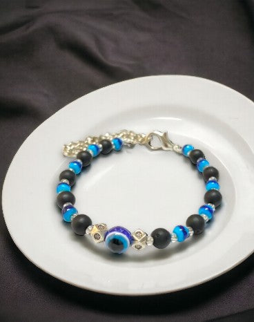 Gray Poseidon Fortune’s Shield Evil Eye bracelet featuring blue and silver beads, designed for jewelry and watch accessories.