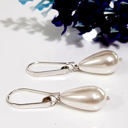 Maroon Smudge Dew Drop teardrop shell pearl earrings with silver hooks, featuring elegant, glossy shell pearls on delicate earrings.