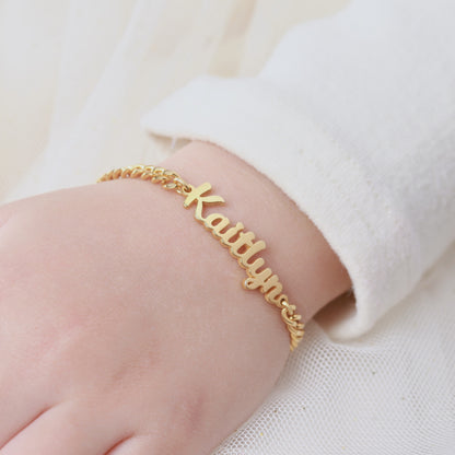 Green Millie child name bracelet featuring a delicate design, perfect for little girls, with personalized baby name jewelry.