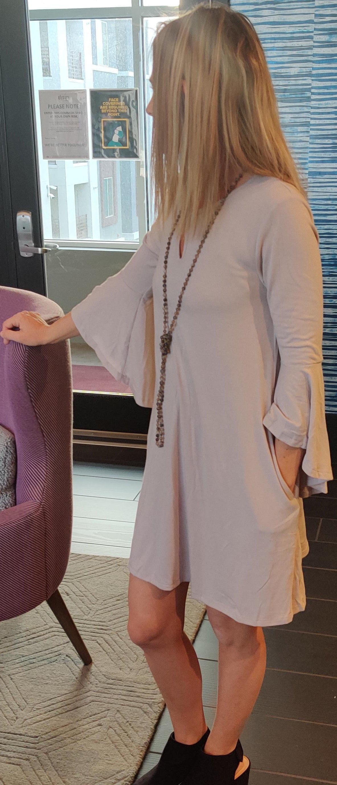 Light gray ruffle sleeve dress with keyhole neckline and pockets, by Ochre Ismene, perfect for stylish women&