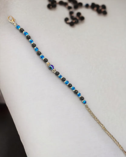 Gray Poseidon Fortune’s Shield Evil Eye Bracelet, protective jewelry featuring a blue eye charm on a silver band.