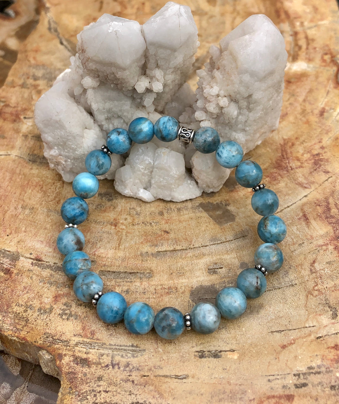 Blue Apatite stretch bracelet made of natural gemstones with round beads, designed for a comfortable fit and elegant style.