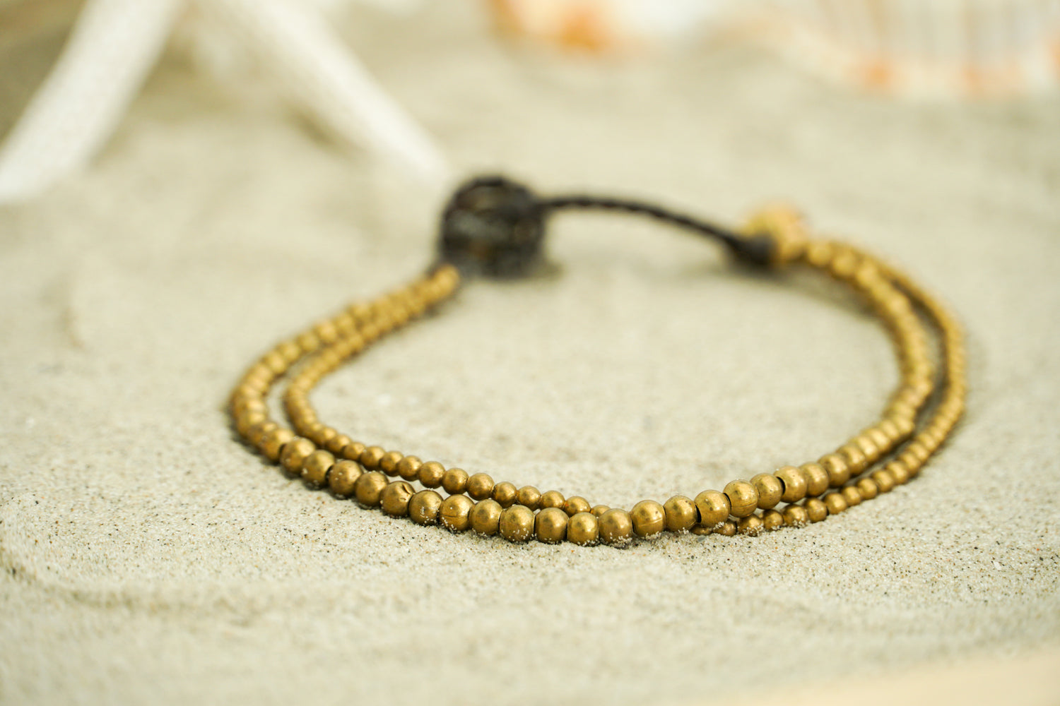 Golden double strand boho brass bracelet with hippie style, featuring intricate design and adjustable clasp, by Tan Smokey.