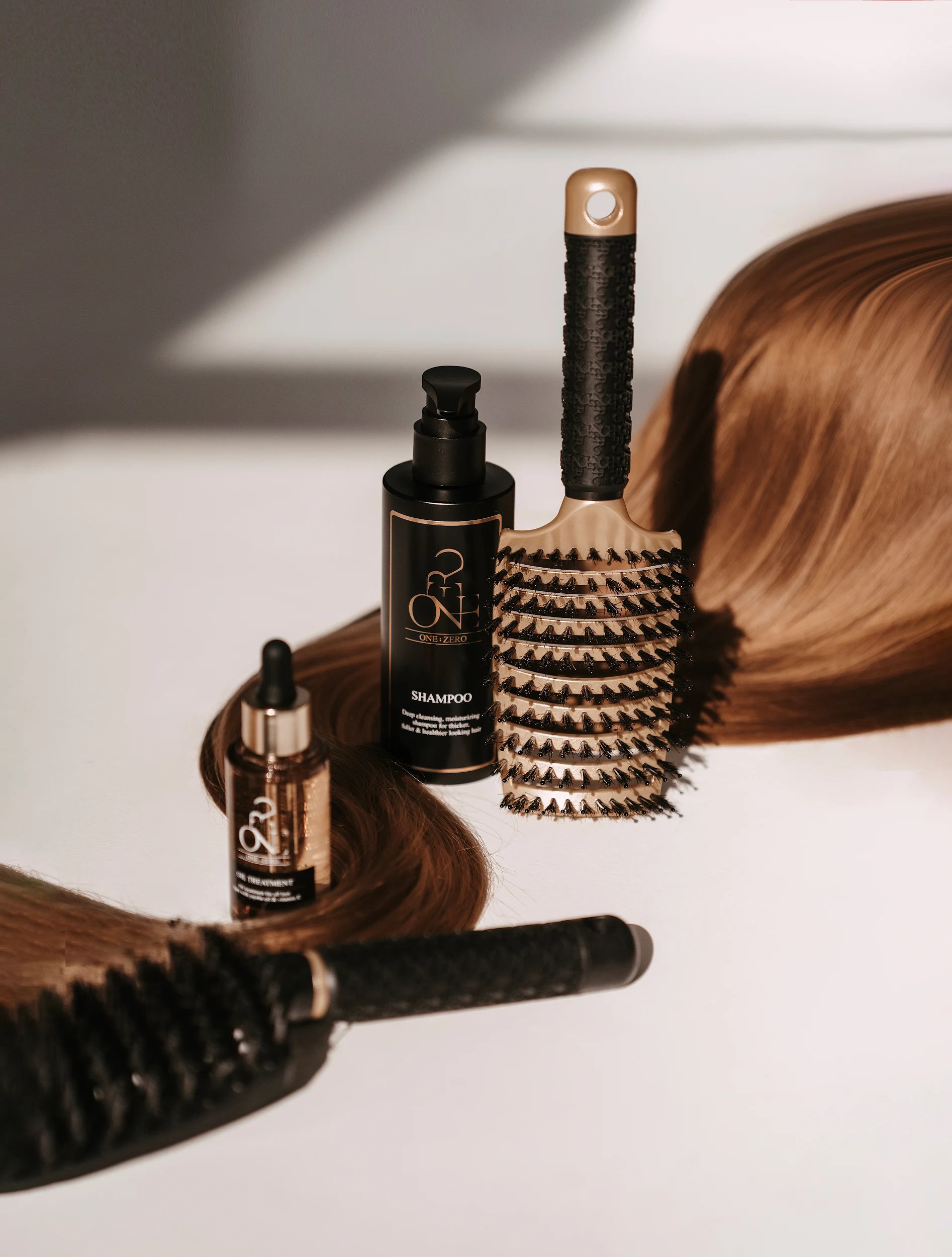 Black Burgundy Clover hair comb for haircare, showcasing the sleek, durable plastic design with fine teeth for gentle styling.