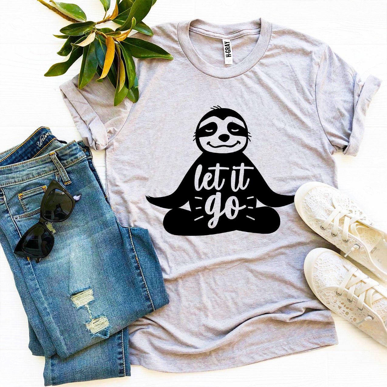 Agate Let It Go T-shirt featuring a casual design with bold printed text on soft cotton fabric, shown on a hanger.