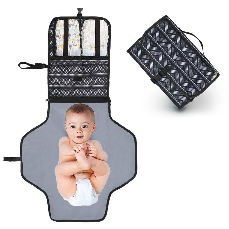 Foldable waterproof changing pad for babies by Teal Simba, featuring soft, portable diaper cover mat for newborns and infants.